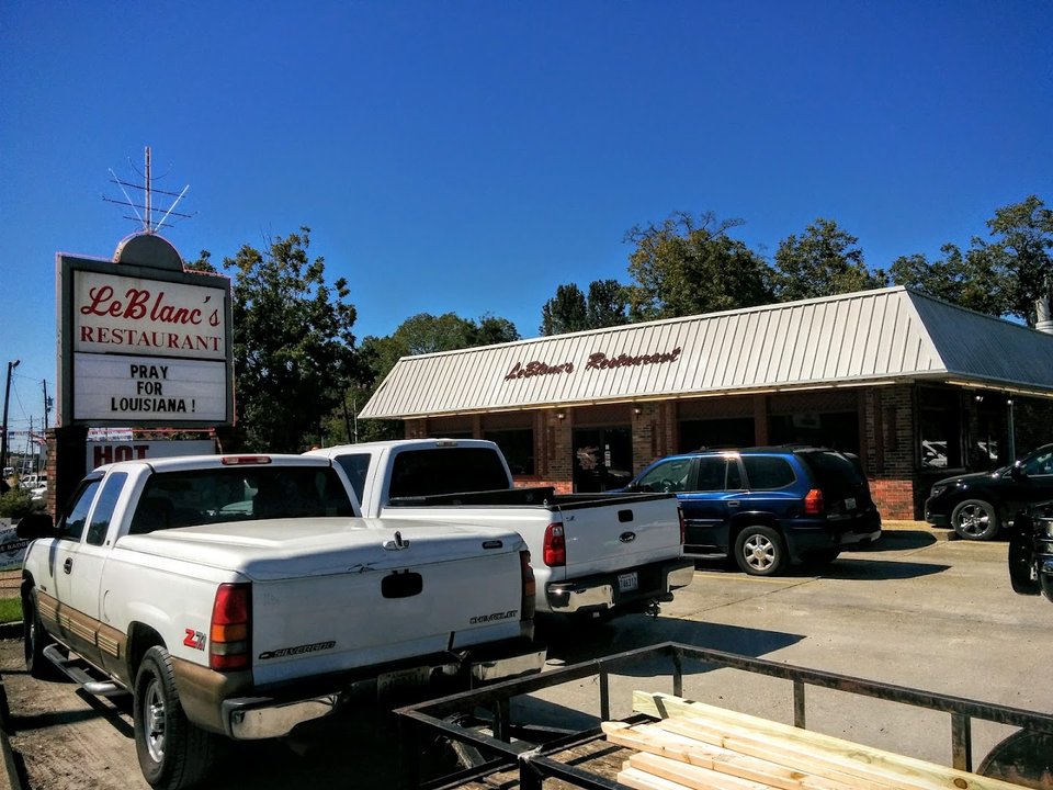 Drive-in restaurant exterior with parking spaces.