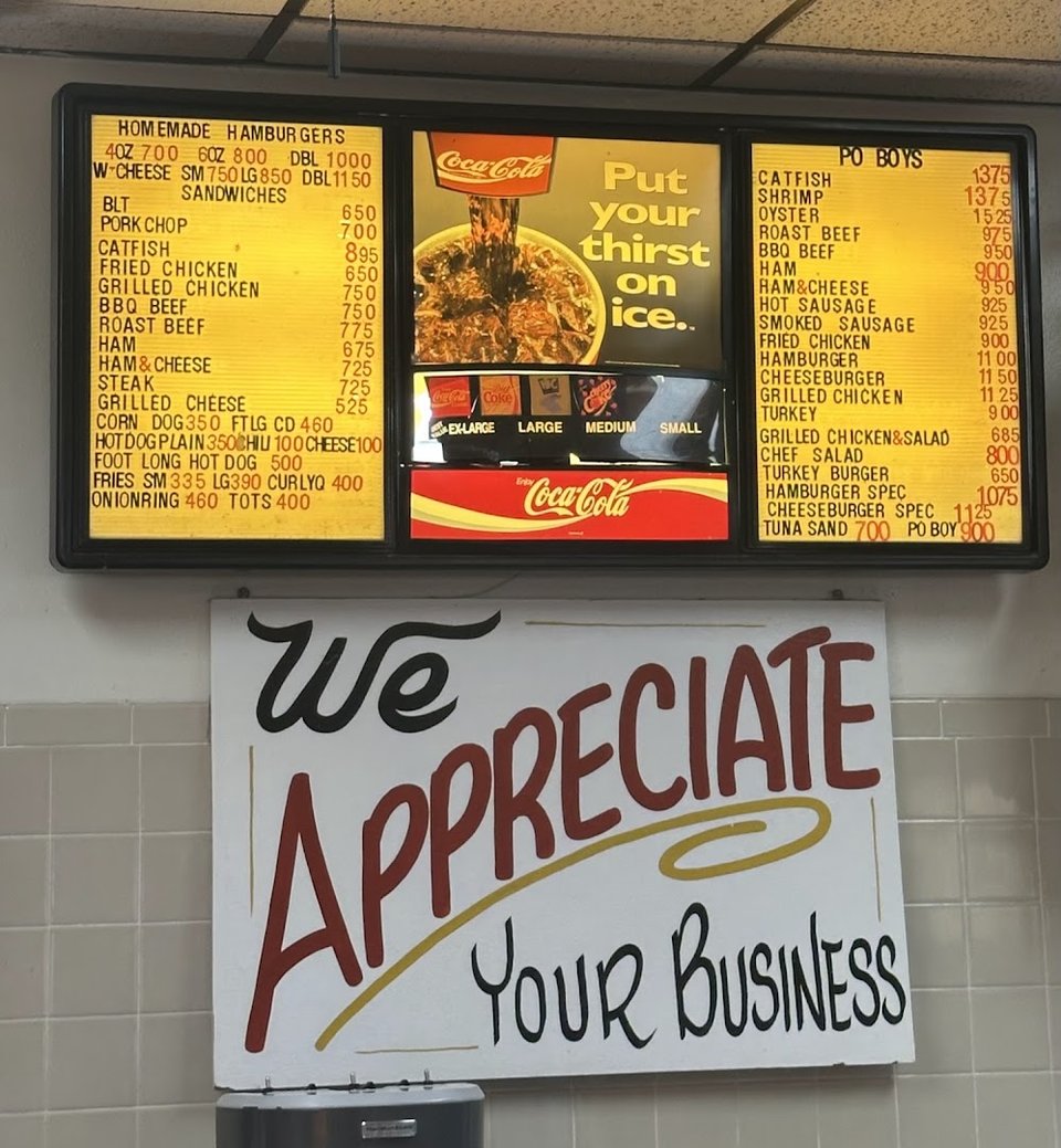 Drive-in restaurant exterior with parking spaces.